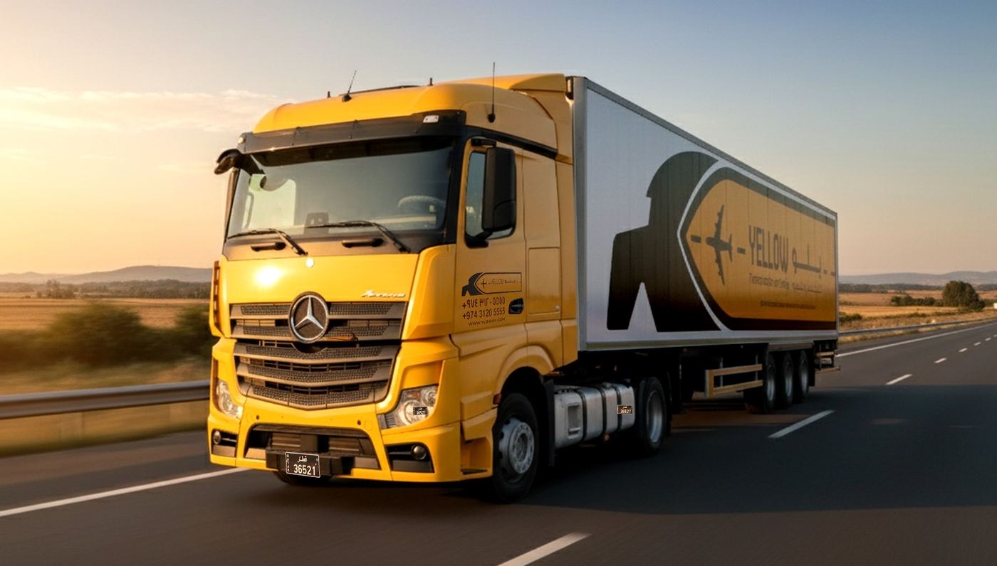 Yellow truck on a highway at sunrise